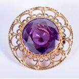 A 1970S 14CT GOLD AND AMETHYST BROOCH. 10 grams. 3 cm wide.