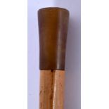 A 19TH CENTURY CONTINENTAL CARVED RHINOCEROS HORN HANDLED WALKING CANE. 82 cm long.