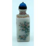 A Chinese snuff bottle decorated with birds and foliage. 9cm.