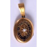 AN ANTIQUE YELLOW METAL ENAMEL AND PEARL MOURNING LOCKET. 11 grams. 4.5 cm x 2.5 cm.