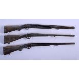 THREE EDWARDIAN BRONZE RIFLES. 26.5 cm long. (3)