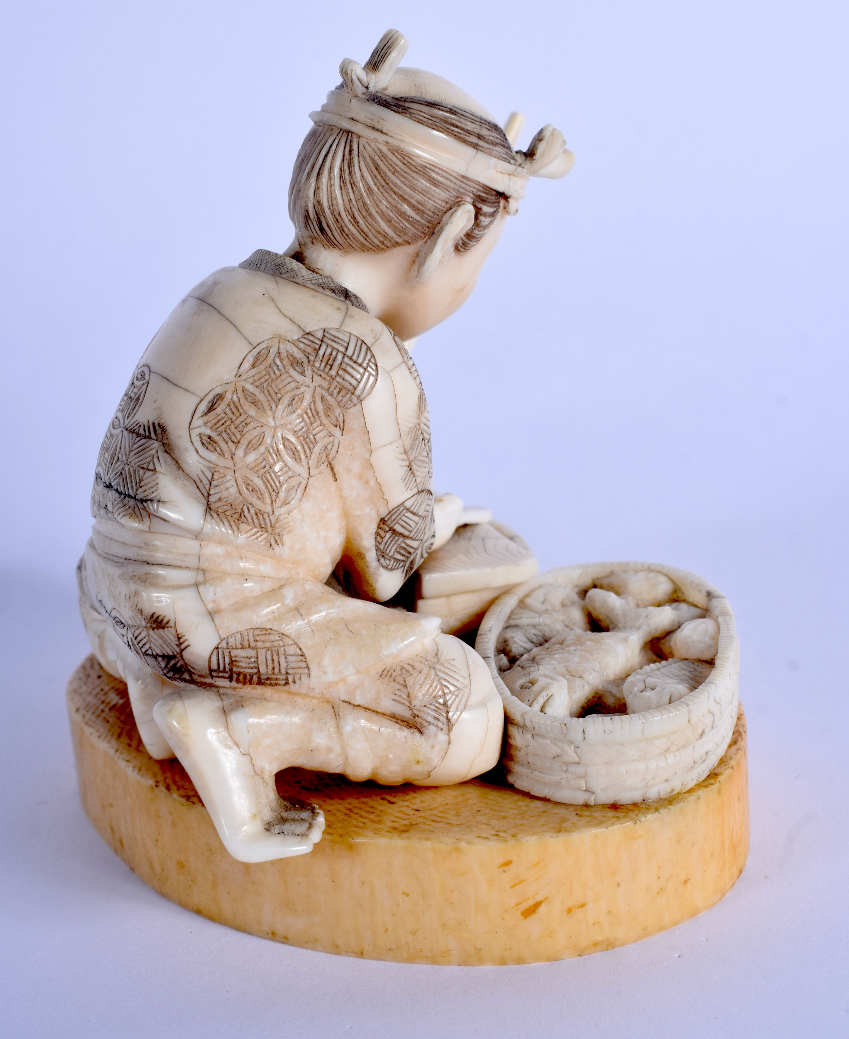 A 19TH CENTURY JAPANESE MEIJI PERIOD CARVED BONE FIGURE OF A MALE modelled preparing fish. 8 cm x 9 - Image 3 of 4