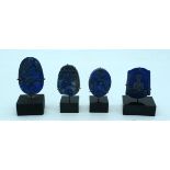 A collection of carved Lapis Lazuli boulders on stands 6cm .