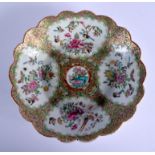 A 19TH CENTURY CHINESE CANTON FAMILLE ROSE BARBED BOWL Qing, painted with flowers. 22 cm wide.