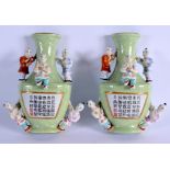 A PAIR OF EARLY 20TH CENTURY CHINESE FAMILLE ROSE PORCELAIN WALL POCKETS Late Qing/Republic, painted