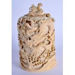 A 19TH CENTURY JAPANESE MEIJI PERIOD CARVED IVORY DRAGON VASE AND COVER modelled amongst crashing wa