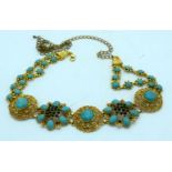 A Chinese Gilt metal belt with Turquoise stone inserts. 100 cm in length.