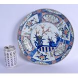 A LARGE 17TH/18TH CENTURY CHINESE BLUE AND WHITE DOUCAI DISH Kangxi/Yongzheng, painted with floral p