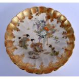 A FINE 19TH CENTURY JAPANESE MEIJI PERIOD SCALLOPED SATSUMA PLATE painted with geisha in various pu