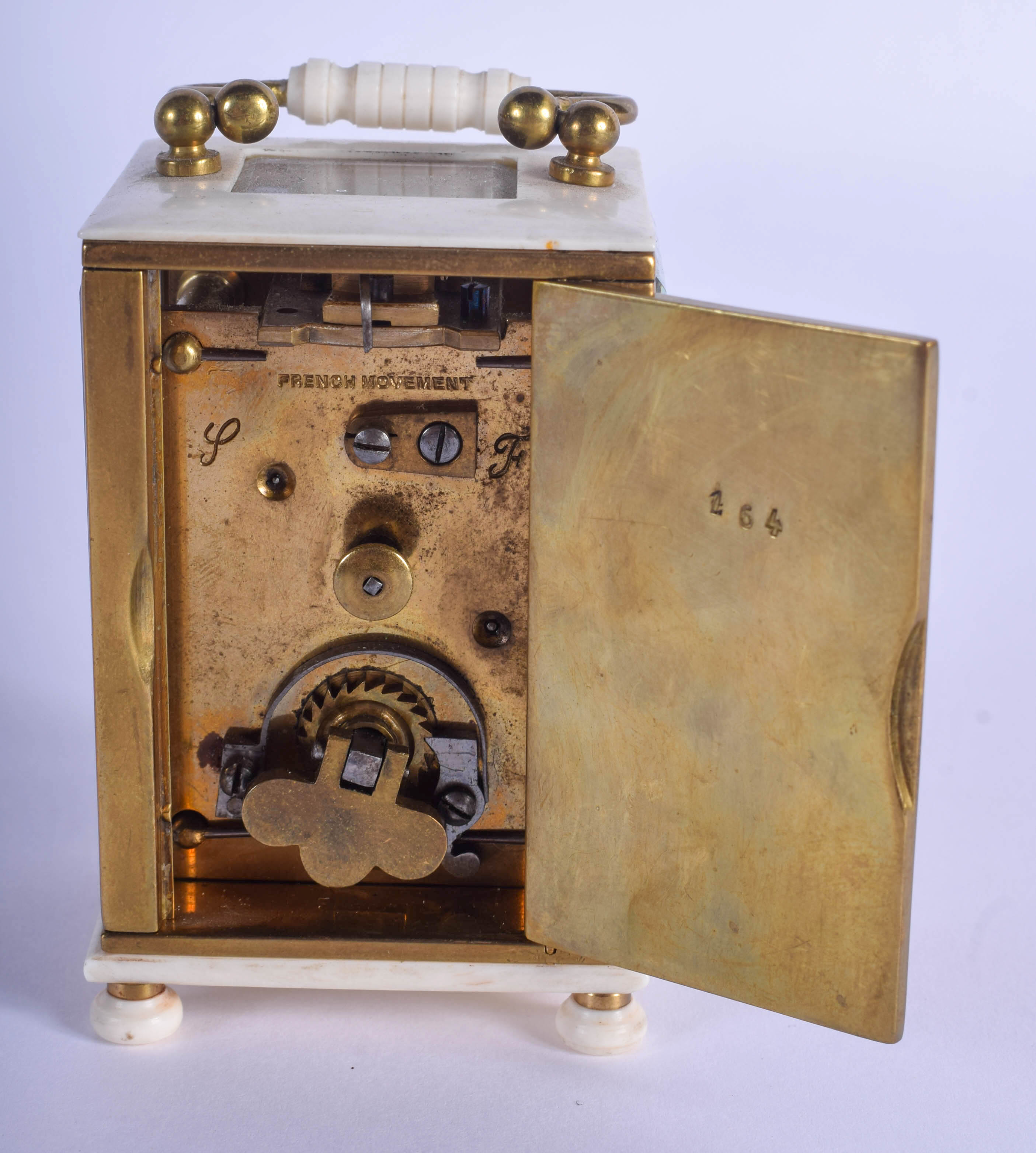 A 19TH CENTURY EUROPEAN MINIATURE CARVED IVORY CARRIAGE CLOCK of plain form. 9 cm high inc handle. - Image 3 of 4