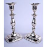 A PAIR OF ENGLISH SILVER CANDLESTICKS. 1247 grams loaded. 23.5 cm x 11 cm.