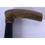 A 19TH CENTURY CONTINENTAL CARVED RHINOCEROS HORN HANDLED WALKING CANE. 82 cm long.