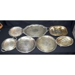 Collection of large silver plated serving salvers Largest 74 x 17 cm (7).