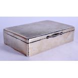 AN ART DECO SILVER CIGARETTE BOX. Chester 1922. 302 grams overall. 13 cm x 9 cm.