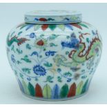 A Chinese Doucai ginger jar and cover decorated with dragons .