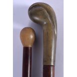 TWO 19TH CENTURY CONTINENTAL CARVED RHINOCEROS HORN HANDLED WALKING CANES. 88 cm long. (2)