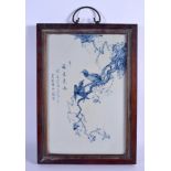 A CHINESE BLUE AND WHITE PORCELAIN PLAQUE 20th Century, painted with birds and calligraphy. Porcelai