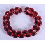 A CHERRY AMBER TYPE NECKLACE. 207 grams. 94 cm long.