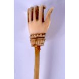 A 19TH CENTURY MIDDLE EASTERN INDIAN CARVED RHINOCEROS HORN AND IVORY BACK SCRATCHER of highly unusu