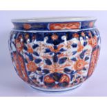 A 19TH CENTURY JAPANESE MEIJI PERIOD IMARI RIBBED JARDINIERE painted with flowers. 16 cm x 18 cm.