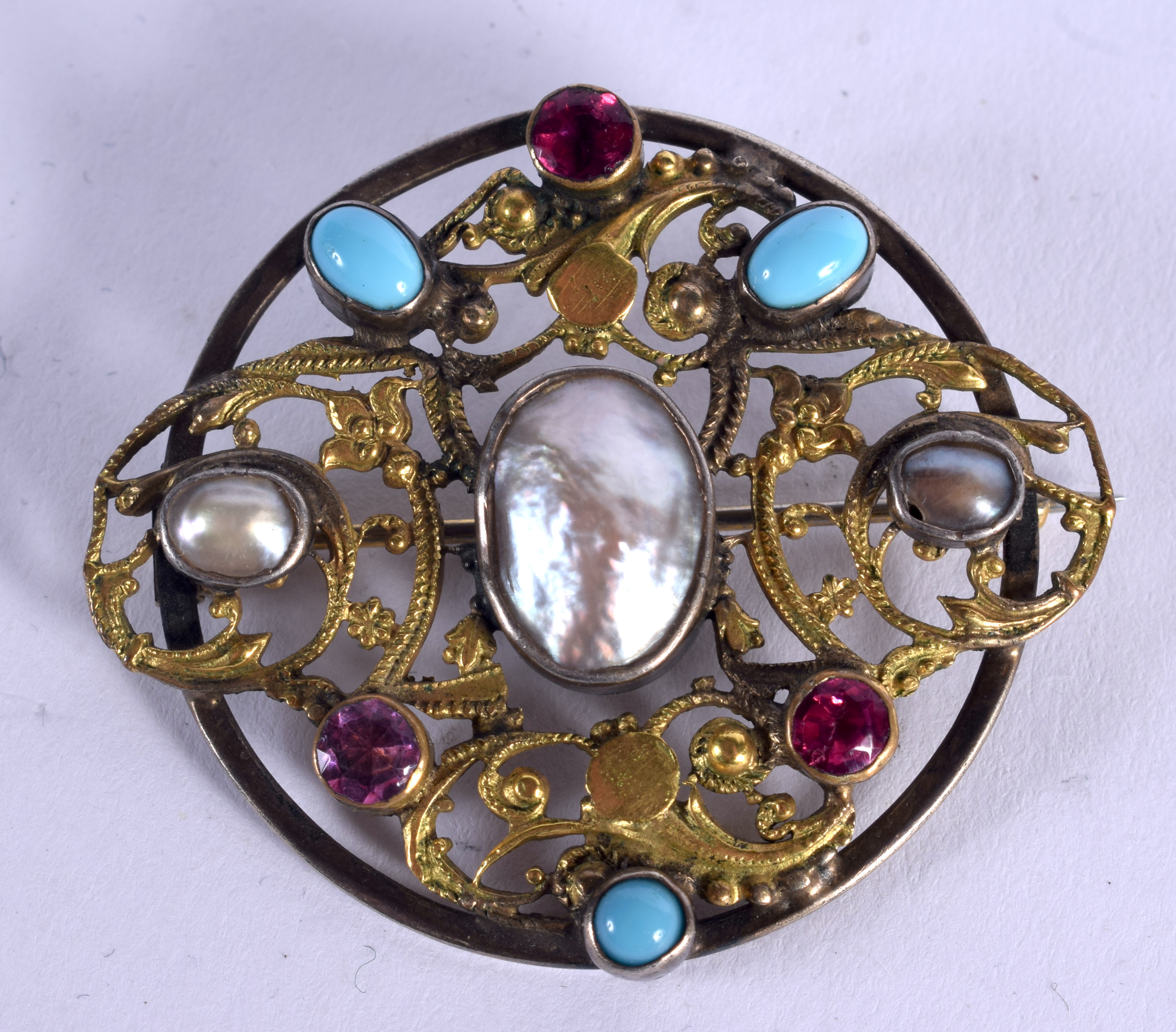 A 19TH CENTURY AUSTRO HUNGARIAN BAROQUE PEARL AND RUBY BROOCH. 3.5 cm wide.