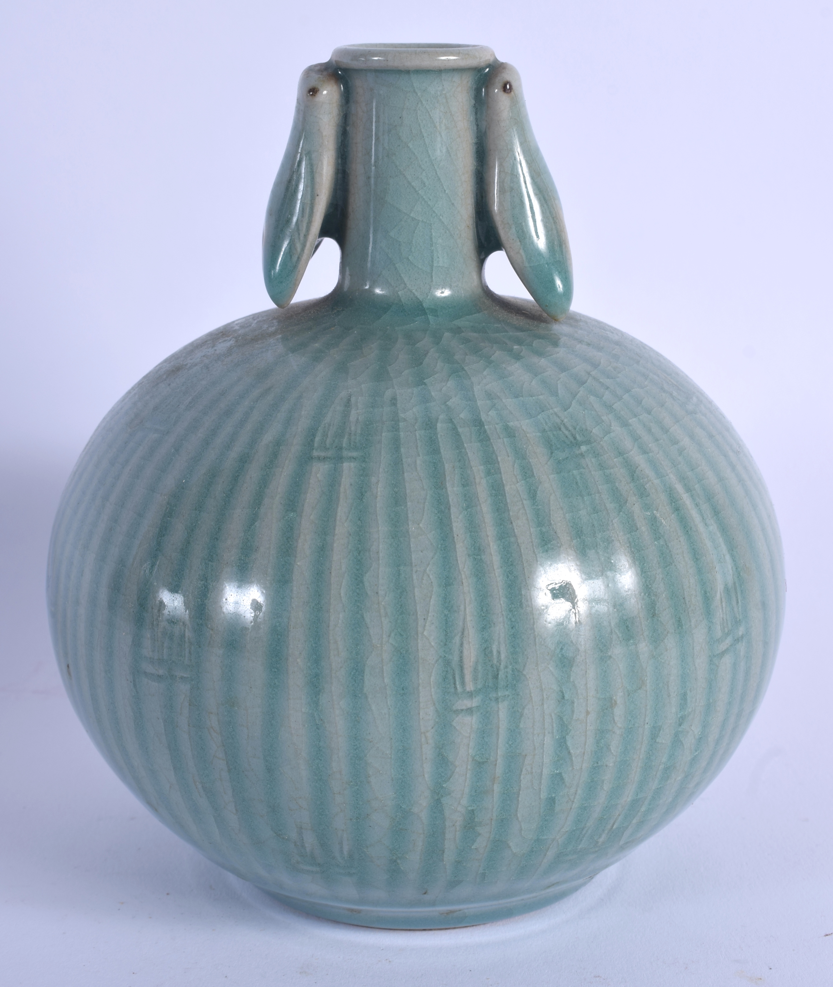 A KOREAN CELADON TWIN HANDLED BULBOUS VASE. 14 cm x 9 cm.