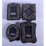 FOUR SMALL SILVER PHOTOGRAPH FRAMES. London 1985 and others. 194 grams overall. Largest 9 cm x 7 cm.