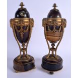 A PAIR OF 19TH CENTURY EUROPEAN GILT BRONZE MOUNTED BLUE JOHN URNS with reversible tops. 30 cm high.