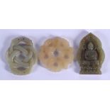 THREE CHINESE CARVED JADE PLAQUE PENDANTS 20th Century, in various forms and sizes. Largest 5 cm x 5