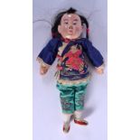 AN EARLY 20TH CENTURY CHINESE FIGURE OF A DOLL Late Qing, modelled wearing a silk robe. 23 cm long.