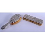 AN EARLY 20TH CENTURY INDIAN SILVER BRUSH and matching rectangular brush. 420 grams overall. Largest