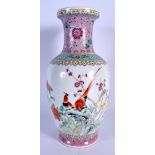 A CHINESE FAMILLE ROSE PORCELAIN MEIPING VASE 20th Century, painted with figures and flowers. 24 cm