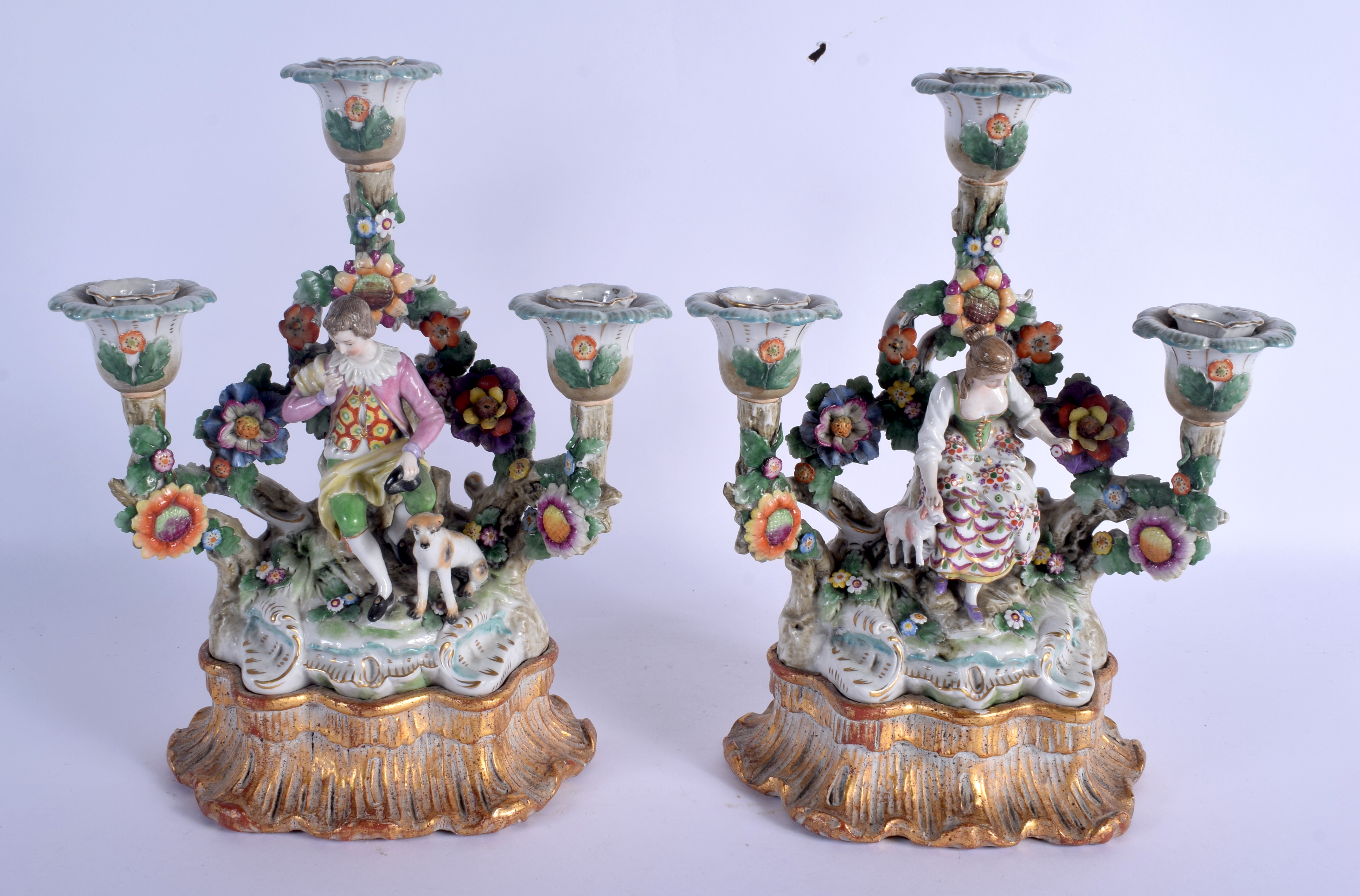 A PAIR OF 19TH CENTURY CONTINENTAL PORCELAIN FIGURES modelled upon a rococo base. Porcelain 26 cm x