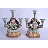 A PAIR OF 19TH CENTURY CONTINENTAL PORCELAIN FIGURES modelled upon a rococo base. Porcelain 26 cm x