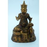 A bronze Chinese Tibetan Buddha with coloured bead inserts. 26cm.