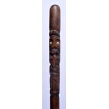 AN EARLY 20TH CENTURY CARVED TRIBAL SHELL INSET SWAGGER STYLE STICK possibly Maori or Hawaiian. 73 c