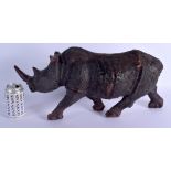 A LARGE VINTAGE CARVED AFRICAN WOOD FIGURE OF A ROAMING RHINOCEROS modelled upon all fours. 45 cm x