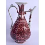 A CHINESE QING DYNASTY IRON RED GLAZED PORCELAIN EWER Ming style, painted with flowers and vines. 27