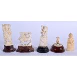 A 19TH CENTURY ANGLO INDIAN CARVED IVORY SNAKE CHARMER together with four others. Largest 8 cm high.