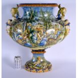 A VERY LARGE 19TH CENTURY ITALIAN TWIN HANDLED MAJOLICA VASE painted with figures within landscapes.