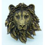 A Bronze lions head wall hanging .