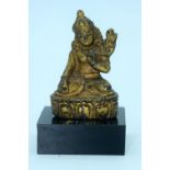 A small Chinese Tibetan gilt bronze Buddha mounted on a base. 6cm.