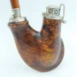 A RARE AND UNUSUALLY SHAPED WALNUT PIPE with metal fittings, and associated stem. 11 cm high (2)