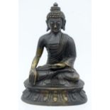 A 19TH CENTURY CHINESE TIBETAN BRONZE FIGURE OF A SEATED BUDDHA modelled with one hand raised upon a