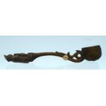 A 19TH CENTURY CARVED TREEN FRUITWOOD SERVING SPOON formed as a seated male upon a scrolling body. 2