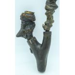 A 19TH CENTURY CONTINENTAL CARVED ROOTWOOD PIPE with associated stem and bowl. Pipe 10 cm x 6 cm.(3)