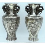 A PAIR OF LATE 19TH CENTURY CHINESE EXPORT TWIN HANDLED SILVER VASES in the manner of Wang Hing, dec