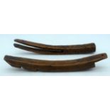 TWO 18TH/19TH CENTURY CARVED DUTCH TREEN FRUITWOOD SLIDE together with another similar example. 20 c