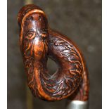 AN 18TH/19TH CENTURY CARVED ROOTWOOD SPIRALISED WALKING CANE the top formed with a coiled serpent. 8