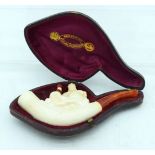 AN ANTIQUE MEERSCHAUM AND AMBER KING PIPE. 12 cm wide.